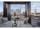 Relaxing balcony with stylish seating and a view of the surrounding city neighborhood at 2330 Eliot St # 1, Denver, CO 80211