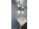 Modern bathroom features a vanity with quartz countertop and pendant lighting at 2330 Eliot St # 1, Denver, CO 80211