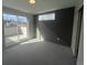 Bedroom features a large sliding glass door and a modern accent wall at 2330 Eliot St # 1, Denver, CO 80211