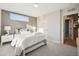 Serene bedroom with a comfortable bed, stylish accent wall, and ample natural light at 2330 Eliot St # 1, Denver, CO 80211