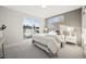 Inviting bedroom featuring a plush bed, modern accent wall, and a sliding door to a balcony at 2330 Eliot St # 1, Denver, CO 80211