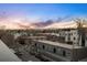 Scenic city view from rooftop vantage point showing surrounding buildings and mountains at dusk at 2330 Eliot St # 1, Denver, CO 80211