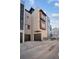 Modern townhome exterior with a two-car garage, sleek finishes, and striking architectural details at 2330 Eliot St # 1, Denver, CO 80211