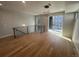 Open living area features hardwood floors and access to an outdoor balcony at 2330 Eliot St # 1, Denver, CO 80211