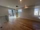 Bright living room offers hardwood floors, large windows, and an outdoor balcony at 2330 Eliot St # 1, Denver, CO 80211