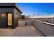 Rooftop with tile flooring, metal siding and wall, offering a perfect outdoor living space at 2330 Eliot St # 1, Denver, CO 80211