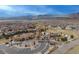 Aerial view of community featuring pool and clubhouse with mountain views, in desirable neighborhood at 2190 S Poppy St, Lakewood, CO 80228