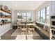 The dining area is well-lit and airy, with built-in benches and a large window at 2190 S Poppy St, Lakewood, CO 80228