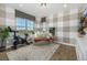 Well-lit exercise room featuring a stationary bike, comfortable seating, and large windows with scenic views at 2190 S Poppy St, Lakewood, CO 80228