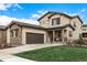 Charming two-story home with a two-car garage and beautifully manicured front lawn at 2190 S Poppy St, Lakewood, CO 80228