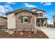 Landscaped front yard with river rock and mulch providing excellent curb appeal at 2190 S Poppy St, Lakewood, CO 80228