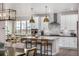Elegant kitchen with a large center island, stainless steel appliances, and a breakfast nook with ample natural light at 2190 S Poppy St, Lakewood, CO 80228
