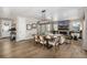 The living room and dining area feature hardwood floors and stylish decor at 2190 S Poppy St, Lakewood, CO 80228