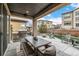 Outdoor patio with grill station, dining table and fire pit perfect for gatherings and enjoying the outdoors at 2190 S Poppy St, Lakewood, CO 80228