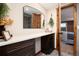 Well-designed bathroom with modern vanity and rustic wooden door at 57 Overlook Ct, Idaho Springs, CO 80452