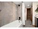 Elegant bathroom featuring a bathtub with shower and decorative tilework at 57 Overlook Ct, Idaho Springs, CO 80452