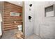 Beautiful bathroom featuring a stand up shower with stone floor and unique log-style wall at 57 Overlook Ct, Idaho Springs, CO 80452