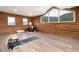 Spacious bonus room offers natural light, a seating area and an exercise area at 57 Overlook Ct, Idaho Springs, CO 80452