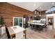 Open floor plan showcasing modern kitchen, island with barstools, and wood accents at 57 Overlook Ct, Idaho Springs, CO 80452