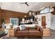 Open concept living space features a modern kitchen, comfortable seating, and a staircase leading to the upper level at 57 Overlook Ct, Idaho Springs, CO 80452