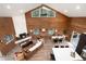 Spacious living room with wood beam ceiling, fireplace, and open floor plan at 57 Overlook Ct, Idaho Springs, CO 80452