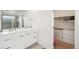 Modern bathroom with a double vanity and walk-in closet at 17693 Elati St, Broomfield, CO 80023