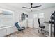 Bright home office features wood floors, built-in shelving, and comfortable seating at 17693 Elati St, Broomfield, CO 80023