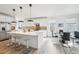 Modern kitchen with island, stainless steel appliances, and breakfast bar at 17693 Elati St, Broomfield, CO 80023