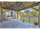 Covered patio area with decorative concrete and access to backyard at 10863 Endeavor Dr, Parker, CO 80134
