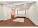 Finished basement featuring a home theater with projector and large screen at 10863 Endeavor Dr, Parker, CO 80134