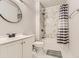 Updated bathroom featuring a tiled shower and modern fixtures at 10863 Endeavor Dr, Parker, CO 80134