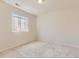 Bedroom with neutral carpet, a window with blinds, and soft natural light at 10863 Endeavor Dr, Parker, CO 80134