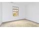 Bedroom with neutral carpet, a window with blinds, and an open, empty space at 10863 Endeavor Dr, Parker, CO 80134