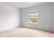 Bright bedroom with neutral carpet and a window offering neighborhood views at 10863 Endeavor Dr, Parker, CO 80134