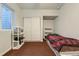 Cozy bedroom with closet and window allowing natural light at 10863 Endeavor Dr, Parker, CO 80134