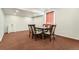 Spacious dining room with modern lighting, neutral walls, and sink area at 10863 Endeavor Dr, Parker, CO 80134