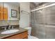Recently remodeled bathroom with modern glass shower and granite countertops at 26196 Rea Ave, Conifer, CO 80433