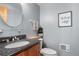 Stylish bathroom with a granite countertop vanity, elegant fixtures, and modern decor at 26196 Rea Ave, Conifer, CO 80433