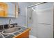 A bright bathroom featuring a tiled sink and a shower with sliding glass doors at 26196 Rea Ave, Conifer, CO 80433