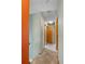 Hallway featuring access to multiple bedrooms and neutral walls throughout at 26196 Rea Ave, Conifer, CO 80433