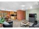 Open living room with a combined kitchen and dining area, and sliding glass doors to the outside at 26196 Rea Ave, Conifer, CO 80433