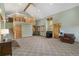 Open-concept living area boasts high ceilings, a wood-burning stove, and a second-floor loft at 26196 Rea Ave, Conifer, CO 80433