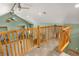 Vaulted open-concept loft space includes seating and an abundance of natural light at 26196 Rea Ave, Conifer, CO 80433