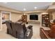 Finished basement offers a spacious entertainment area with comfortable seating at 6402 E Cornell Ave, Denver, CO 80222