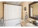 Charming bathroom with a shower-tub combination and granite countertop at 6402 E Cornell Ave, Denver, CO 80222