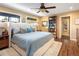 Cozy bedroom with large bed, ample natural light, and a built-in bookshelf at 6402 E Cornell Ave, Denver, CO 80222