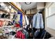 Walk-in closet with built-in shelving provides abundant storage space for shoes and clothes at 6402 E Cornell Ave, Denver, CO 80222