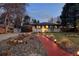 Charming ranch home featuring manicured landscaping and a brick walkway at 6402 E Cornell Ave, Denver, CO 80222