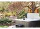 Backyard hot tub and beautiful landscaping offer a perfect oasis for relaxation and tranquility at 6402 E Cornell Ave, Denver, CO 80222
