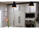 Close-up of modern kitchen appliances with stylish cabinetry and hardware at 6402 E Cornell Ave, Denver, CO 80222